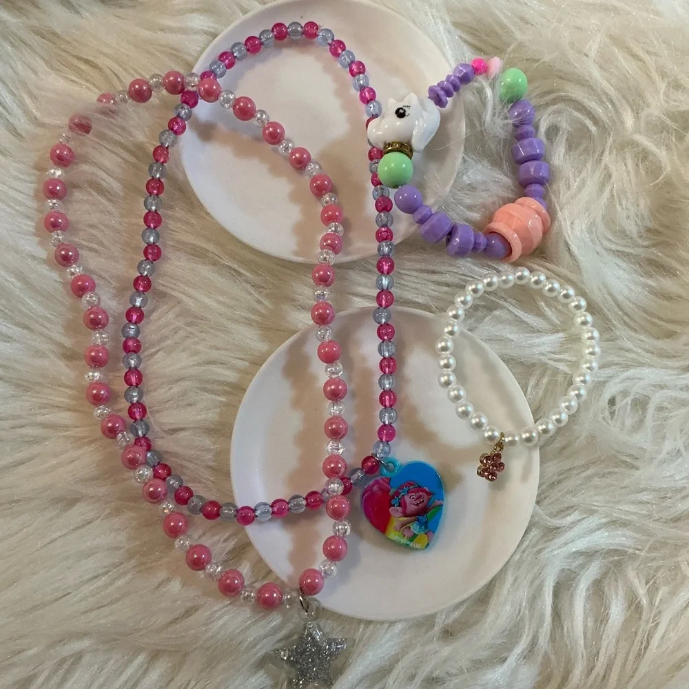 2 necklaces (one Dreamworks Trolls/Poppy) and 2 bracelets for children